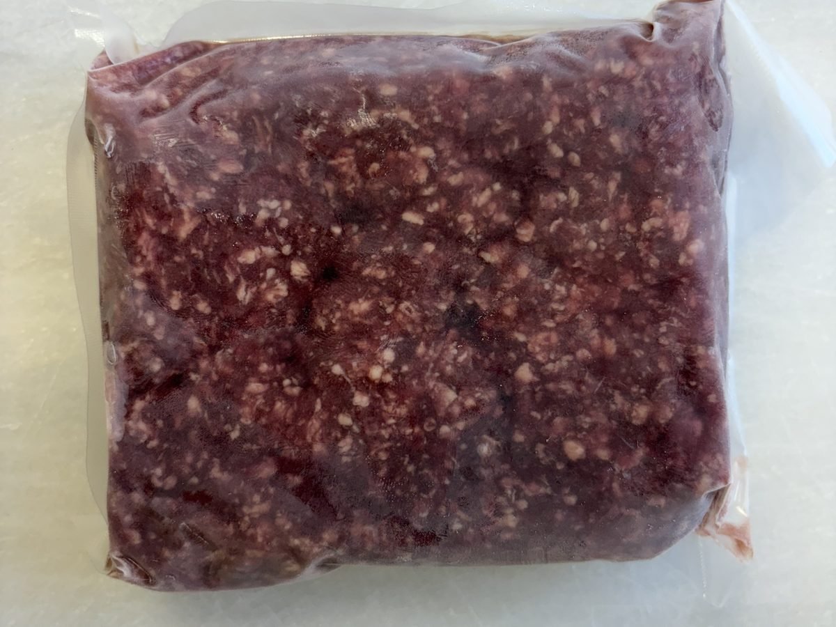 Ground Beef (1-lb packs), vacuum-sealed pack.