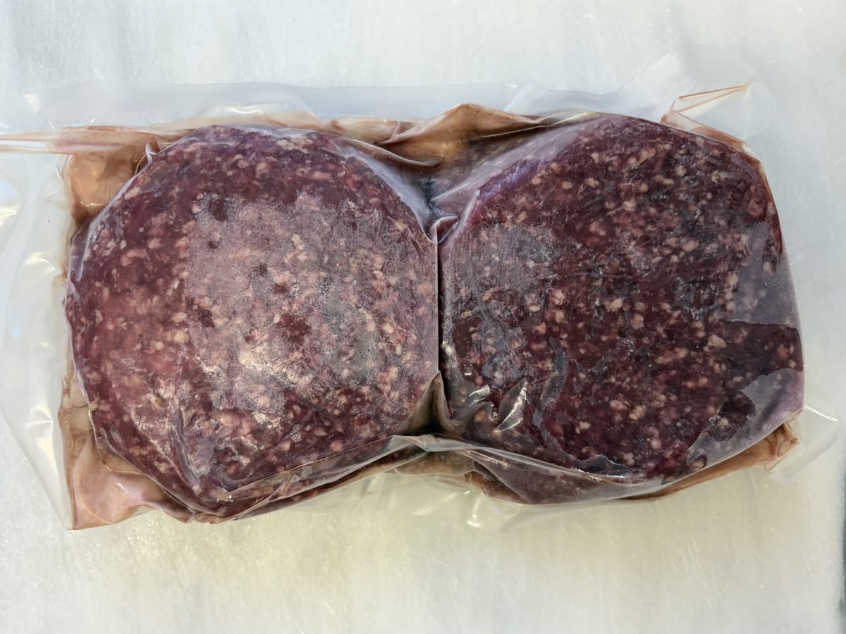 Hamburger Patties (6 oz), vacuum-sealed pack.